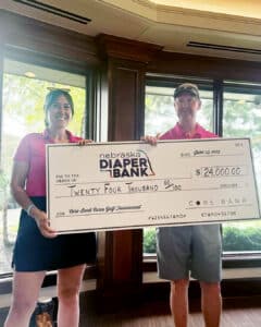 Anna Lehotyak with Nebraska Diaper bank accepted the check from Core Bank’s President, David Hartman.