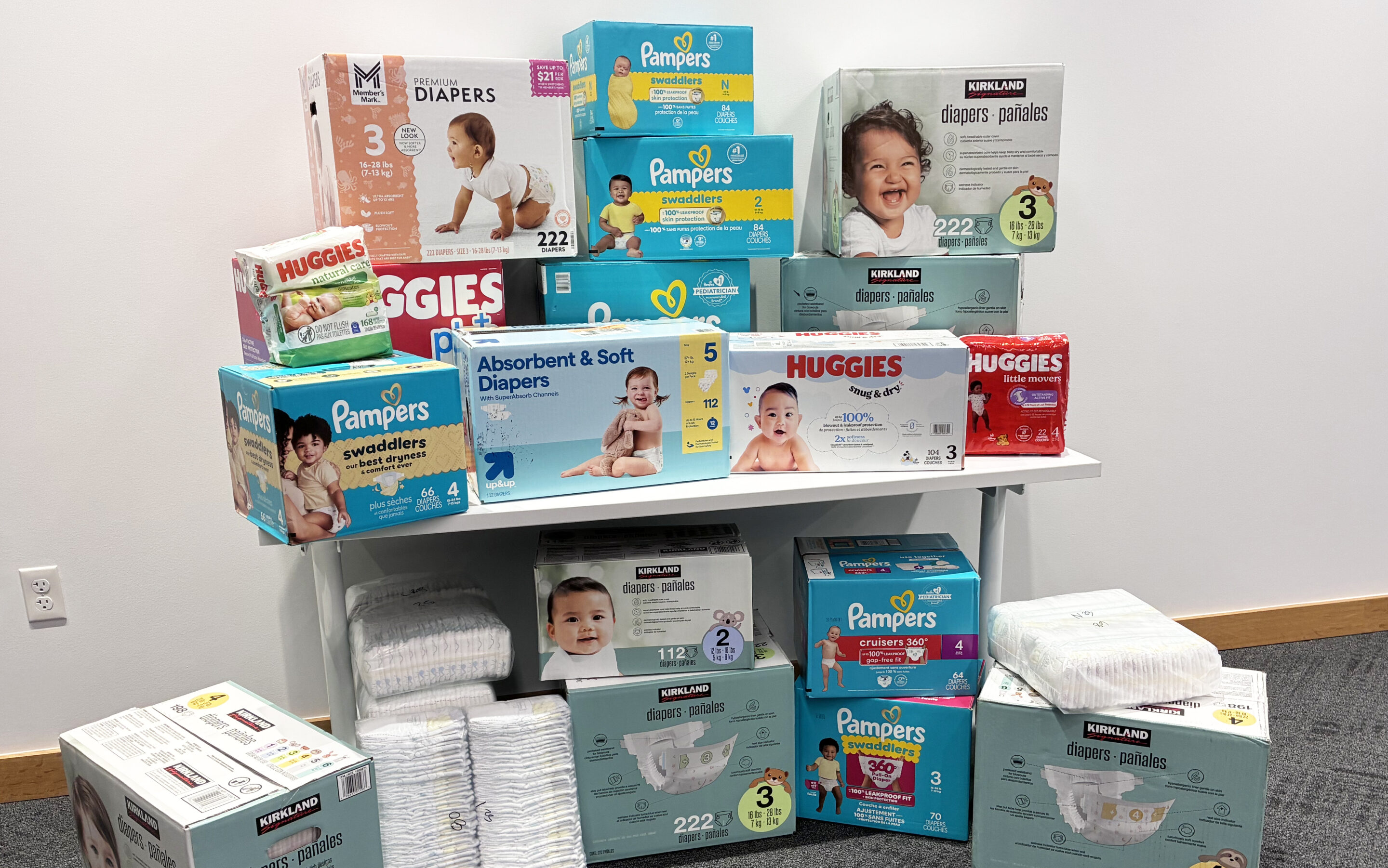Boxes of diapers donated from employees, customers, and businesses