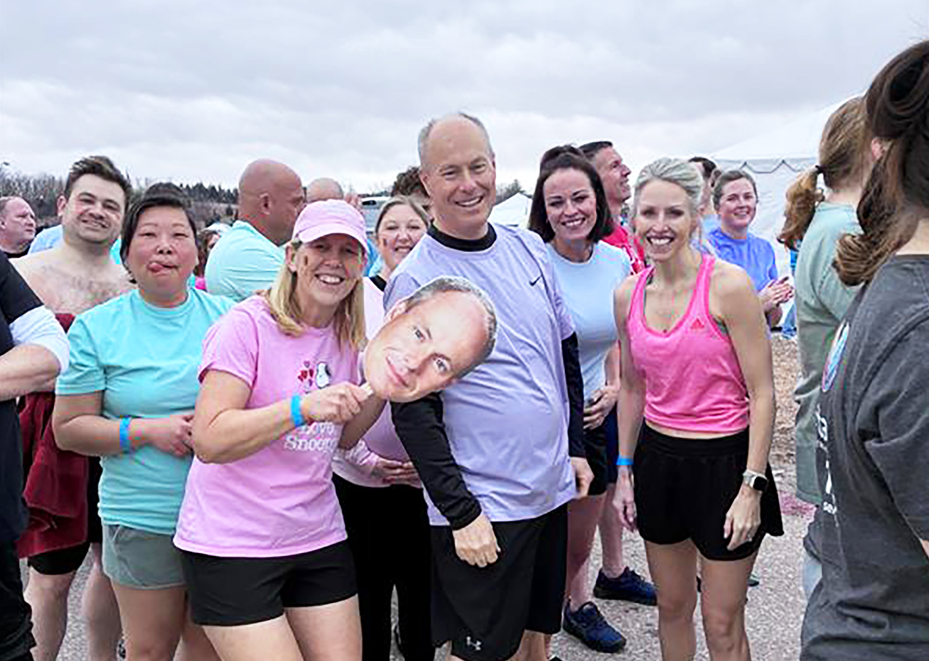 Mike Rasussen surrounded by friends and fellow employees before the polar plunge