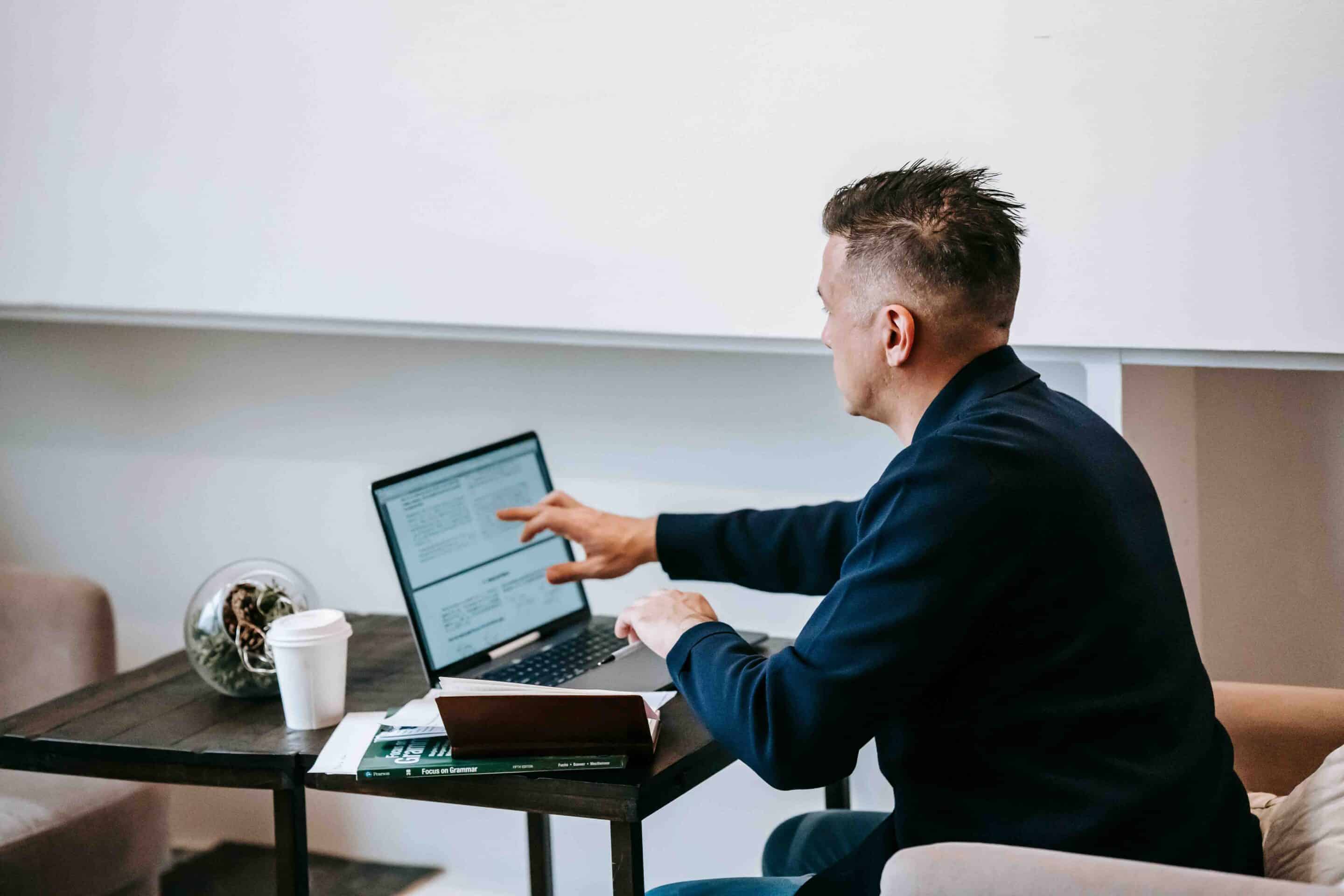 man reading on his computer